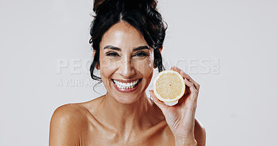 Buy stock photo Happy woman, portrait and skincare with lemon in studio for detox on a white background. Female person, model or smile with natural organic citrus fruit for anti aging diet, vitamin C or antioxidants