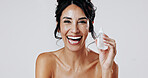 Laughing, portrait and serum with woman in studio for cosmetic satisfaction or dermatology product. Bottle, funny and skincare with mature model isolated on white background for antiaging treatment