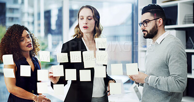 Buy stock photo Woman, team and sticky note on board at office with planning, attorney and insight for solution. People, legal consultant and group with glass wall, feedback and problem solving at corporate law firm