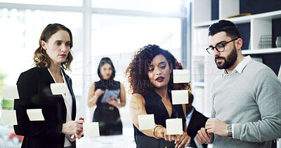 Buy stock photo Woman, team and sticky note on glass at office with planning, attorney and insight for solution. People, legal consultant and group with discussion, feedback and problem solving at corporate law firm
