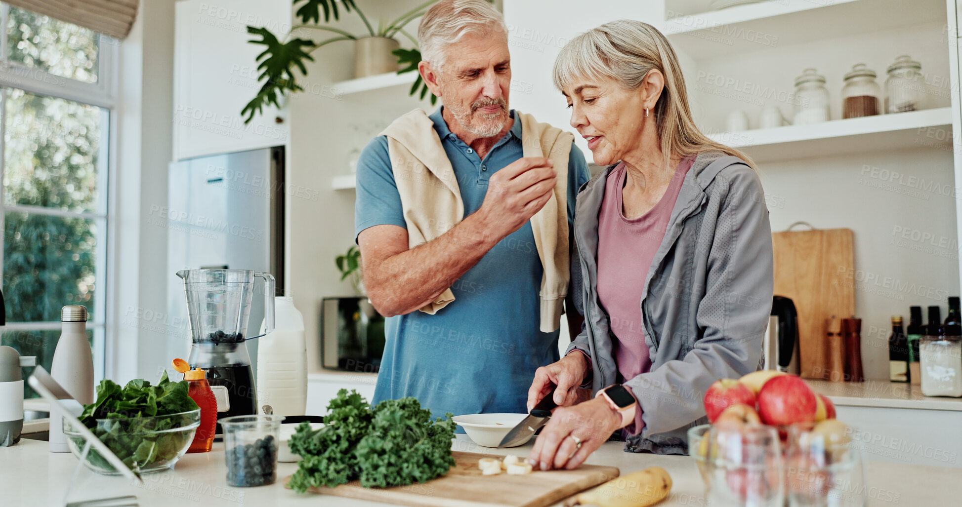 Buy stock photo Blender, fruit and old couple in kitchen with healthy diet, taste test or natural ingredients. Married senior people, chop banana or sample food in house with smoothie recipe, nutrition or breakfast.