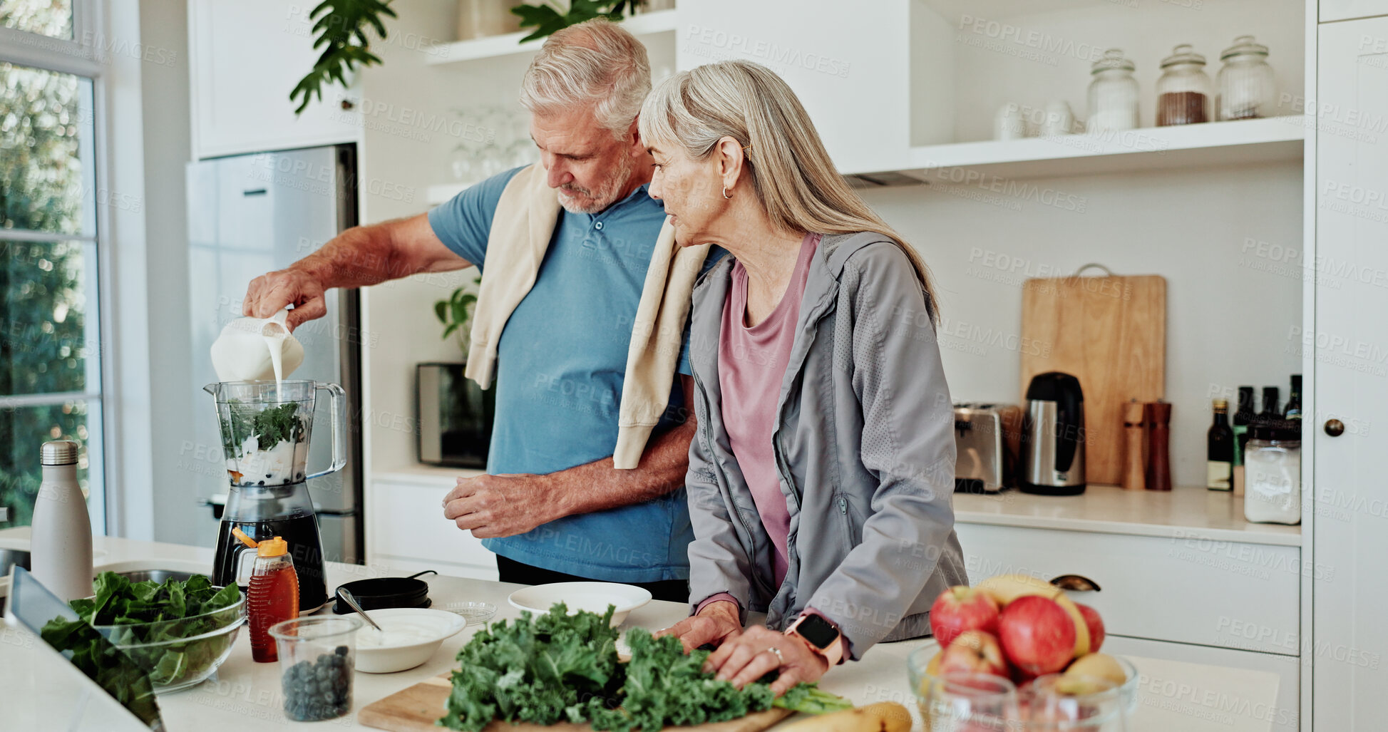 Buy stock photo Kitchen, pour or senior couple with blender for smoothie, prepare ingredients or detox drink for health. Liquid, helping or old people with diet juice for nutrition, home or breakfast shake recipe