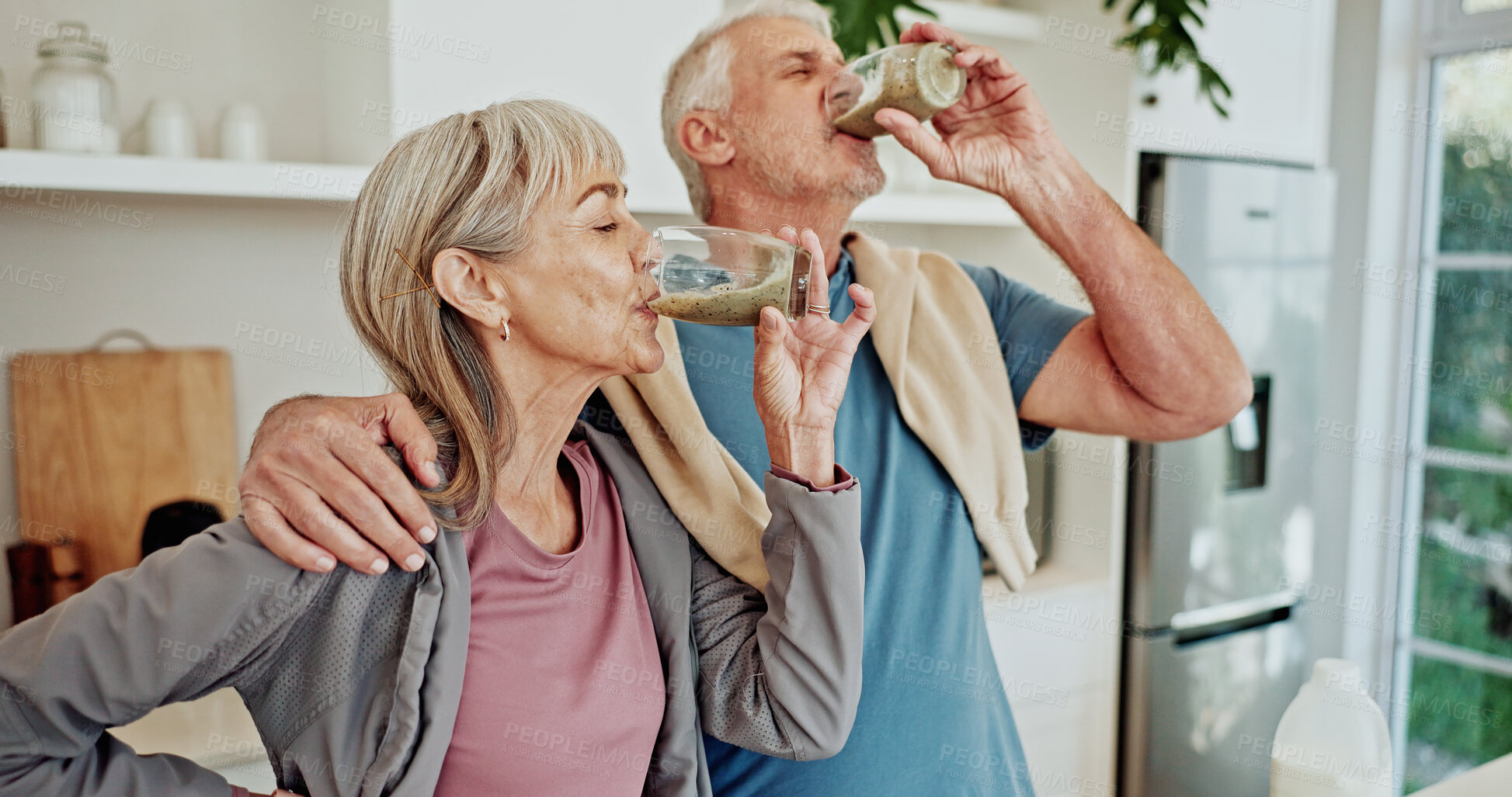 Buy stock photo Fitness, drinking smoothie and old couple in kitchen for nutrition, breakfast and diet plan. Exercise, senior man and woman in home, health and protein shake for wellness, body detox and supplements