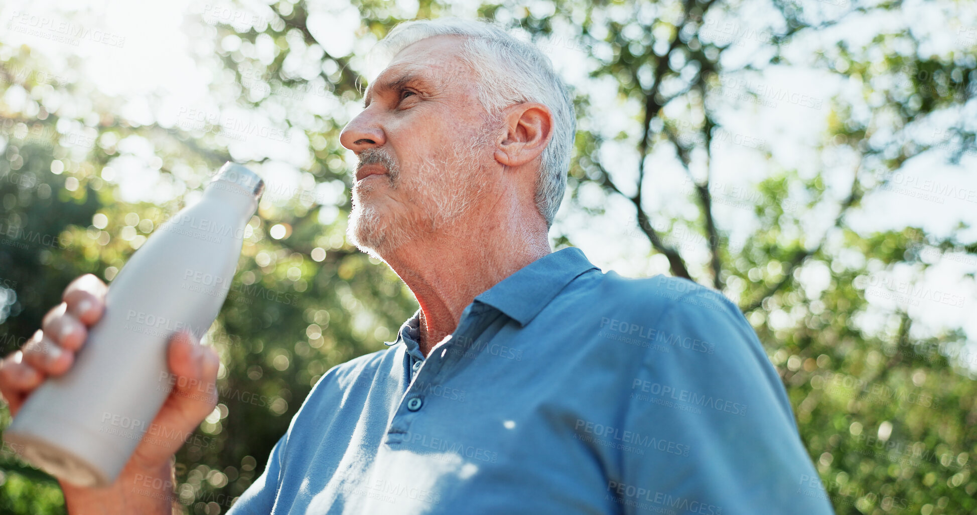 Buy stock photo Fitness, water bottle and old man in garden, low angle and workout for health benefits, Outdoor, pensioner and elderly person in backyard, hydration and thirsty for liquid, exercise and retirement