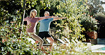 Stretching, yoga and old couple in garden, meditation and exercise for health benefits. Outdoor, senior man and woman in backyard, warrior pose or workout for wellness, retirement or bonding together