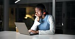 Laptop, night and tired with business black woman in office for planning or research deadline. Bored, computer and reading with African employee at desk in dark workplace for burnout or fatigue