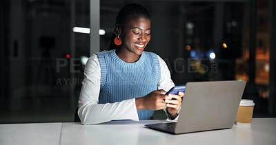 Buy stock photo Night, laptop and black woman in office with phone, journalist research and text message for story. Late, person and typing in workplace with tech, computer and check email for feedback on article.