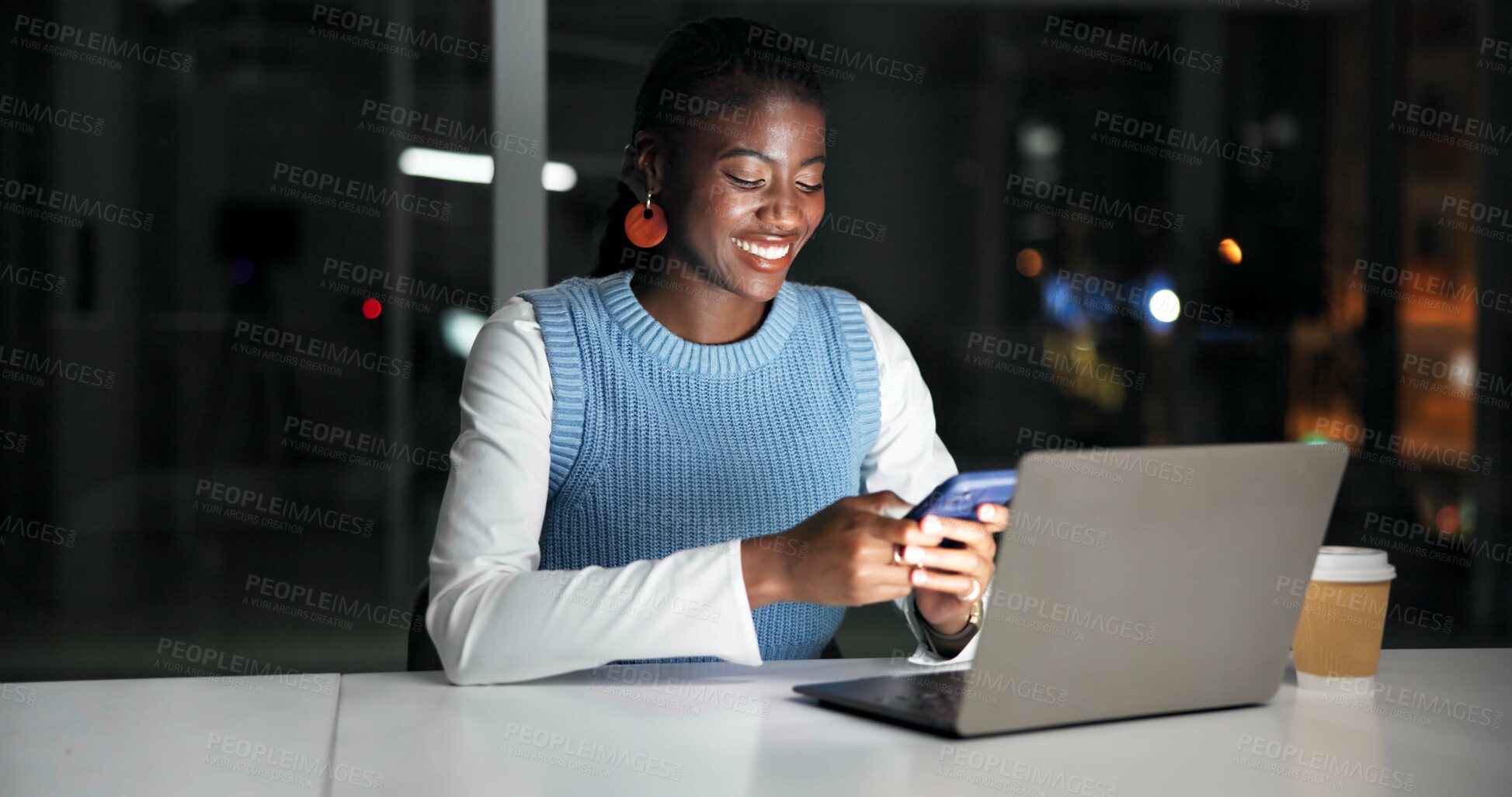 Buy stock photo Night, laptop and black woman in office with phone, journalist research and text message for story. Late, person and typing in workplace with tech, computer and check email for feedback on article.