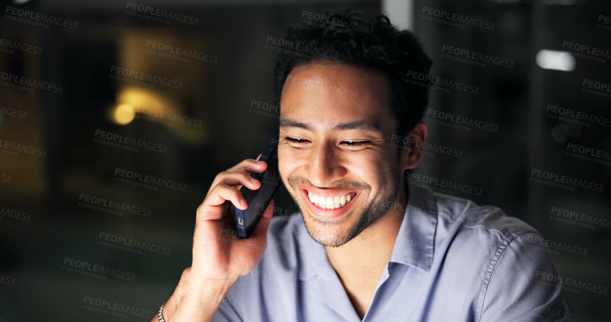 Buy stock photo Night, phone call and smile of business man in office for communication or mobile update. Consulting, conversation and feedback with happy employee person in dark workplace for contact or discussion