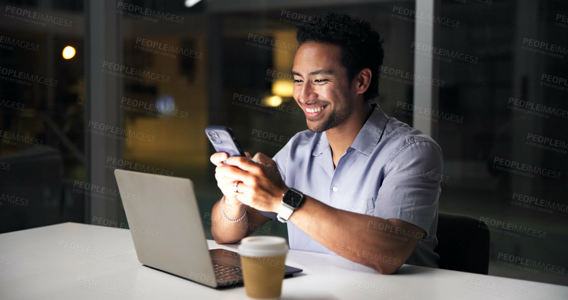 Buy stock photo Night, laptop and man in office with phone, journalist research and text message for story update. Late, person and typing in workplace with tech, computer or email notification for article feedback.