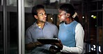 Night, people and discussion in office with tablet, journalist collaboration and research for story. Late, coworkers and talk in workplace with tech, teamwork and review for online news publication.