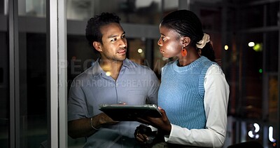 Buy stock photo Night, people and discussion in office with tablet, journalist collaboration and research for story. Late, coworkers and talk in workplace with tech, teamwork and review for online news publication.