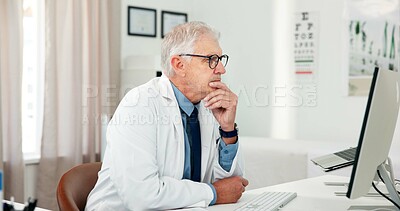 Buy stock photo Computer, doctor and thinking with man in office of hospital for telehealth report, medical diagnosis or research. Healthcare expert, virtual consulting or treatment update with mature person