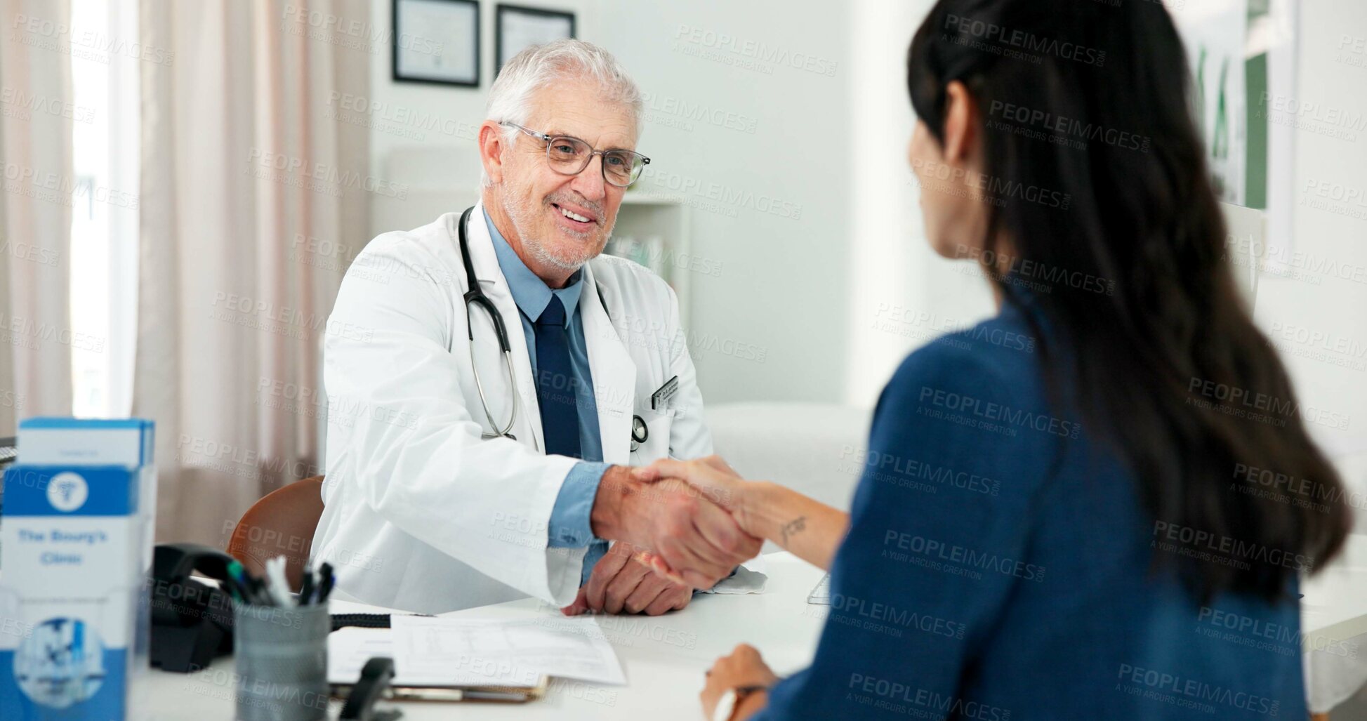 Buy stock photo Handshake, consultation and doctor with woman in hospital with medical diagnosis in office. Shaking hands, checkup and mature healthcare worker with female patient for planning treatment in clinic.