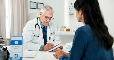 Buy stock photo Writing, consultation and doctor with woman in hospital with medical diagnosis in office. Documents, checkup and mature healthcare worker with female patient for planning treatment in clinic.