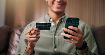 Buy stock photo Credit card, cellphone and hands of man on sofa in home with online shopping, ecommerce or purchase. Technology, debit and male person with phone for paying bills with internet banking in house.
