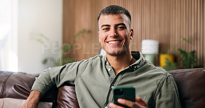 Buy stock photo Happy man, portrait and sofa with phone in home for social media, communication or network. Male person, user or smile with mobile smartphone for research, online chatting or texting app in house