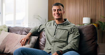 Buy stock photo Happy, portrait and man on sofa in home for weekend, rest and afternoon break in lounge. Smile, holiday and person relax on couch with confidence, positive attitude and pride in house living room