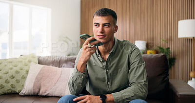 Buy stock photo Man, conversation and voice note with speaker phone for audio message or recording in home. Male person, talking or speaking with technology for chat, vocal app or discussion in house living room