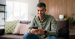 Typing, happy and man on sofa with phone for social media, online dating and message in home. Weekend, house and person on smartphone for internet, connection and chat for notification on mobile app