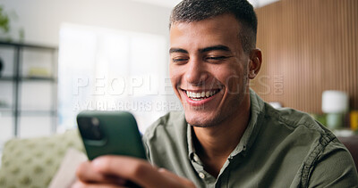 Buy stock photo Laugh, happy and man on sofa with phone for social media, online dating and message in home. Weekend, house and person on smartphone for internet, connection and chat for notification on mobile app