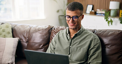 Buy stock photo Man, relax and smile with laptop in living room for movie, streaming film or video. Person, home and digital tech for social media, online podcast and search on weekend for internet entertainment