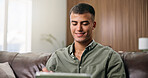 Man, tablet and relax on sofa for social media, communication or entertainment in home living room. Male person, typing and smile on lounge couch with technology for online streaming and search