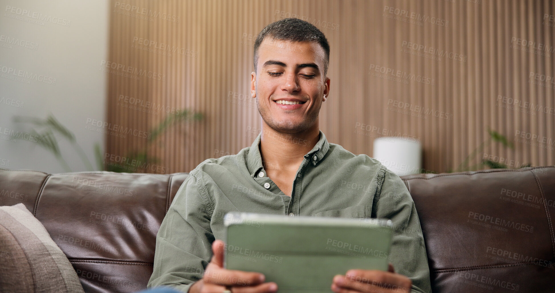 Buy stock photo Happy, tablet and man on sofa for online videos, streaming subscription and watching movies. Home, smile and person on digital tech for internet, website and search to relax on weekend in living room