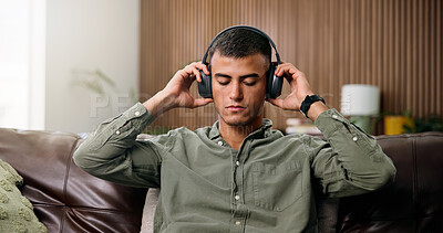 Buy stock photo Man, headphones and reflection on sofa with streaming, chill audio and break on weekend in home. Male person, music and listening to song with eyes closed, relax or podcast in house living room
