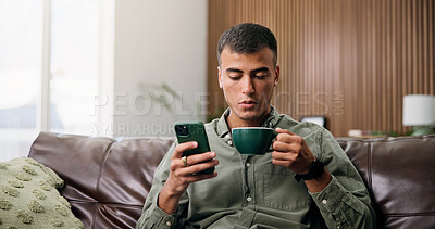 Buy stock photo Coffee, home and man on sofa with phone for social media, online message and chat in living room. Weekend, relax and person on smartphone for internet, connection and text on mobile app with drink