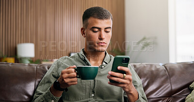 Buy stock photo Relax, coffee and man on sofa with phone for social media, online message and chat in home. Reading, notification and person on smartphone with drink for internet, connection and chill on weekend