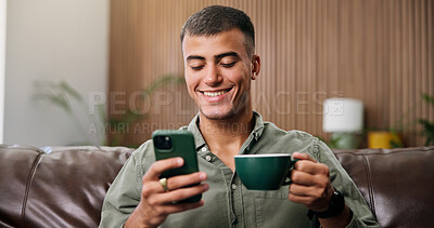 Buy stock photo Coffee, happy and man on sofa with phone for social media, online message and chat in home. Weekend, relax and person on smartphone for internet, connection and notification on mobile app with drink