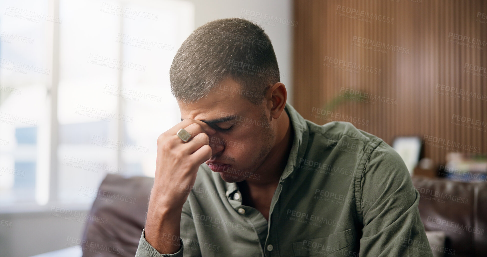 Buy stock photo Frustrated, man and headache with stress in home for loneliness, mistake or anxiety on sofa. Tired, migraine or male person with depression or mental health for fatigue, pressure or strain in house