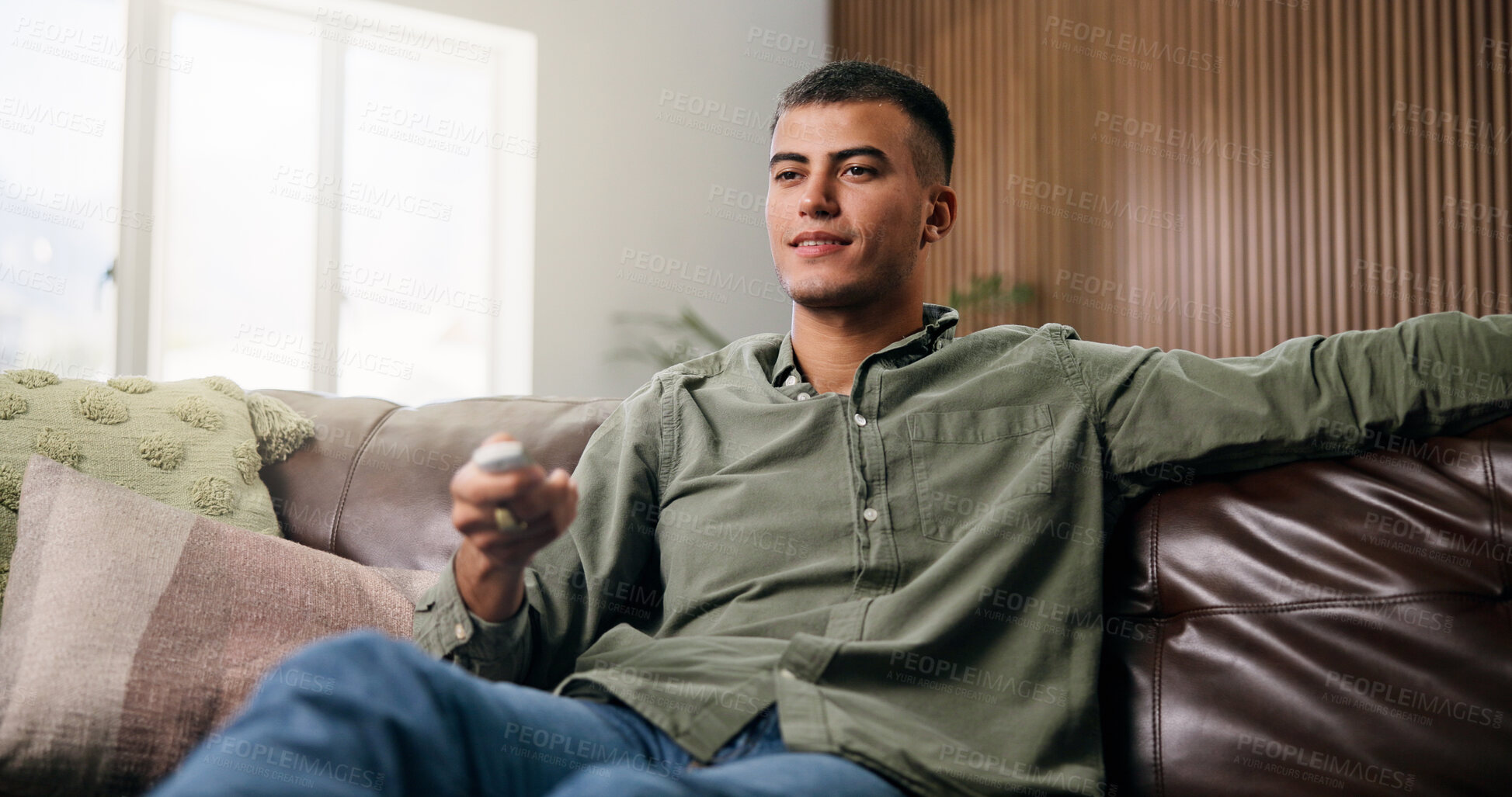 Buy stock photo Choice, remote and man on sofa for watching tv, movie or series in living room for weekend. Relax, subscription and male person in home for streaming film, channel and television show in apartment