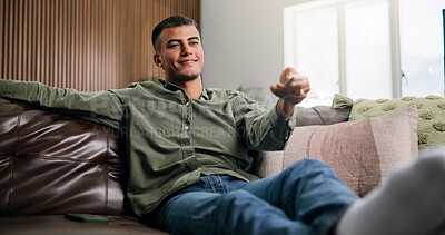 Buy stock photo Relax, remote and man on sofa for watching tv, movie, show or series in living room for weekend. Choice, subscription and male person in home for streaming film, channel and television in apartment