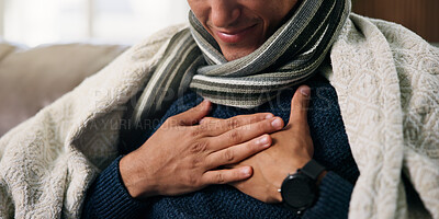 Buy stock photo Hands, chest pain and sick on sofa with blanket for flu, rest and recovery in lounge at house. Person, respiratory illness and cold symptoms with congestion, comfort or healing in living room at home
