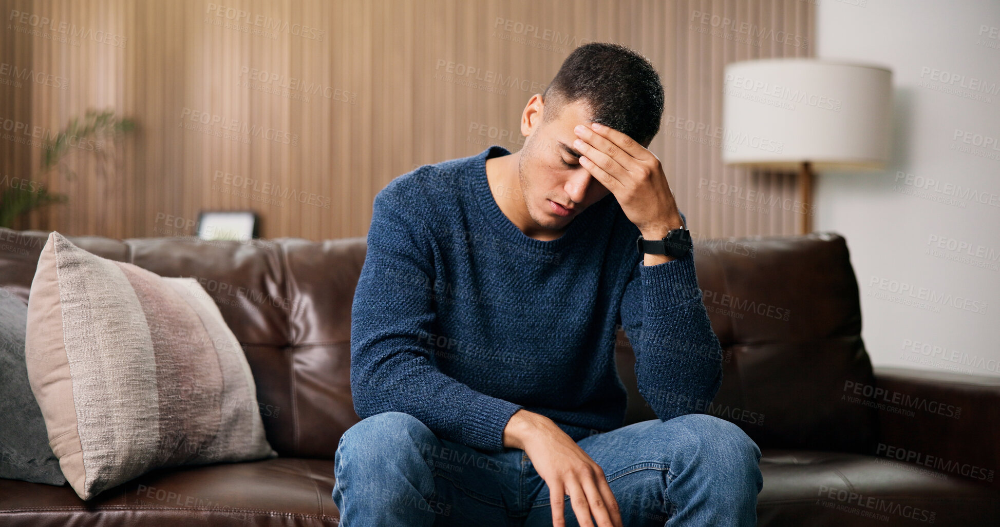 Buy stock photo Frustrated, man and headache with stress on sofa for loneliness, mistake or mental health in home. Tired, migraine or male person with depression for fatigue, pressure or strain on couch in house