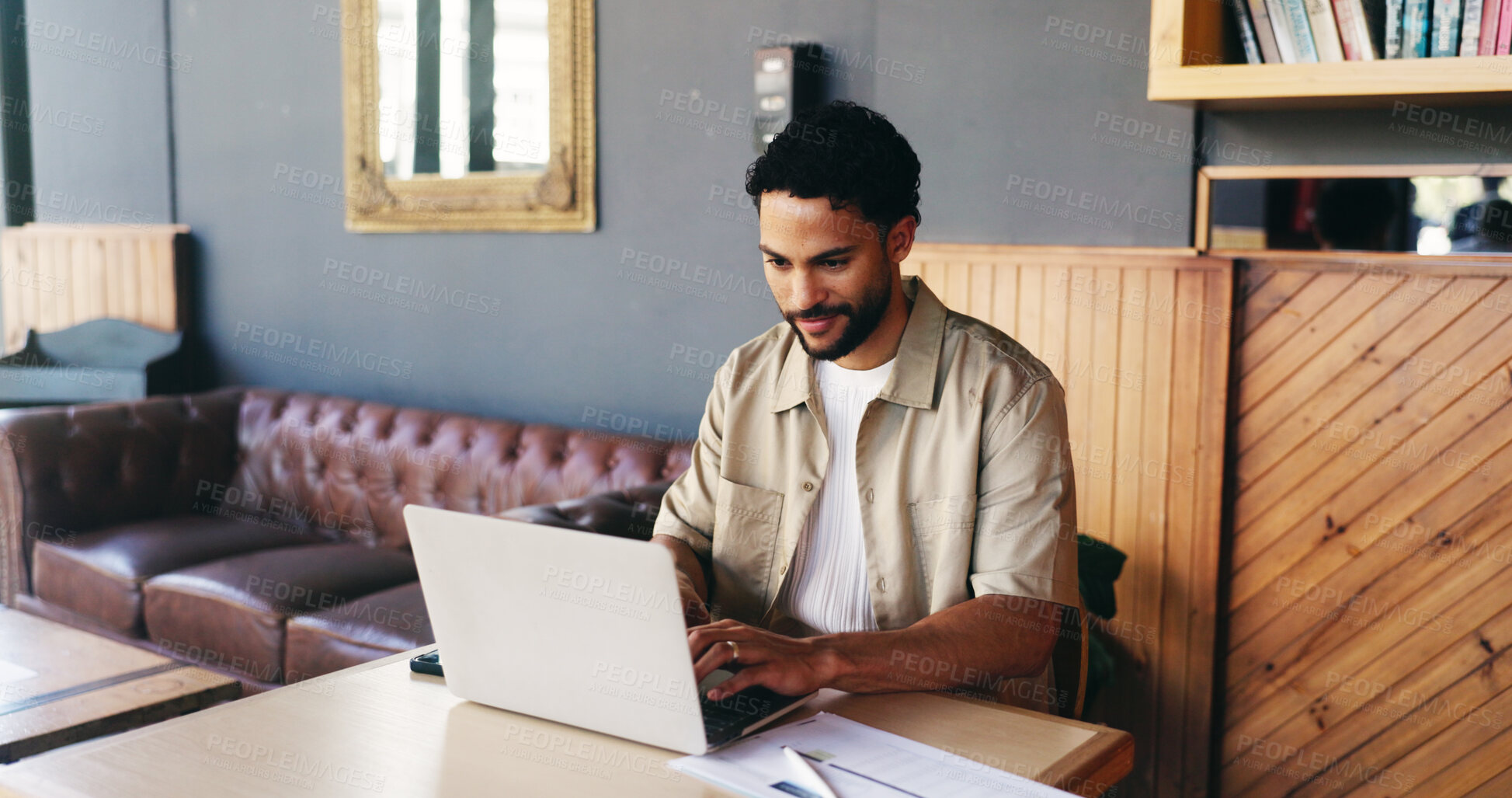 Buy stock photo Remote work, documents and man on laptop in cafe for finance review, budget planning and research. Coffee shop, happy and person on computer with paperwork, graph and charts for financial analysis
