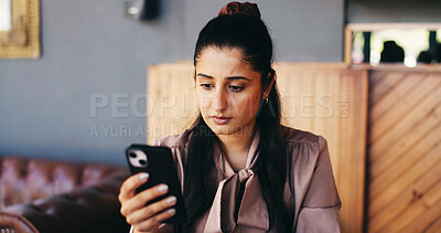 Buy stock photo Woman, customer and reading in restaurant with phone, social media update or online chat notification. Person, browsing website and text message in cafe with tech, mobile app and internet connection.
