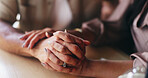 Couple, love and holding hands for support at table, compassion and sympathy for healthy relationship. Comfort, bonding and people with care for marriage commitment, solidarity and kindness in cafe