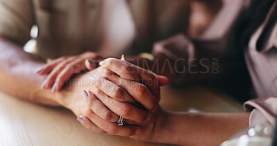 Buy stock photo Couple, love and holding hands for support at table, compassion and sympathy for healthy relationship. Comfort, bonding and people with care for marriage commitment, solidarity and kindness in cafe