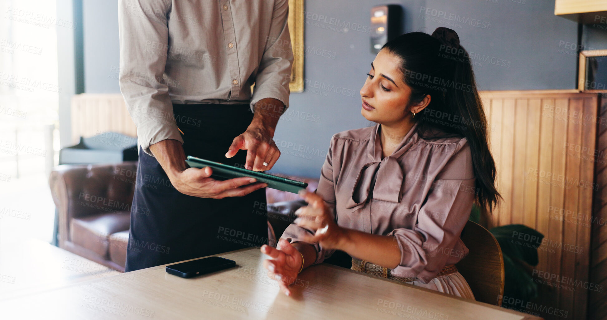 Buy stock photo Woman, waiter and tablet with menu at cafe for order, customer experience and choice at restaurant. People, tech and application for digital price list, service or decision with guide at coffee shop