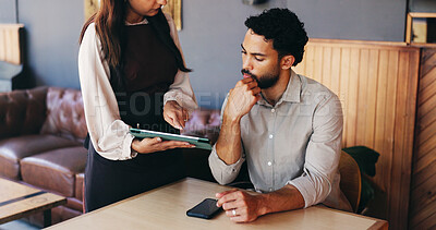 Buy stock photo Man, waitress and tablet with decision at cafe for order, customer experience or menu at restaurant. People, tech and digital price list on application, service or thinking with guide at coffee shop