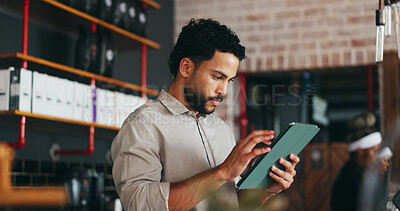 Buy stock photo Manager, man and scroll in restaurant with tablet, booking website and notification for online order. Management, person and reading in diner with tech, hospitality service and email for reservation.