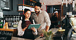 Entrepreneur, couple and reading on tablet in coffee shop, menu management or digital price update. Online order app, review sales or people with food list optimization, tech or remove sold out items