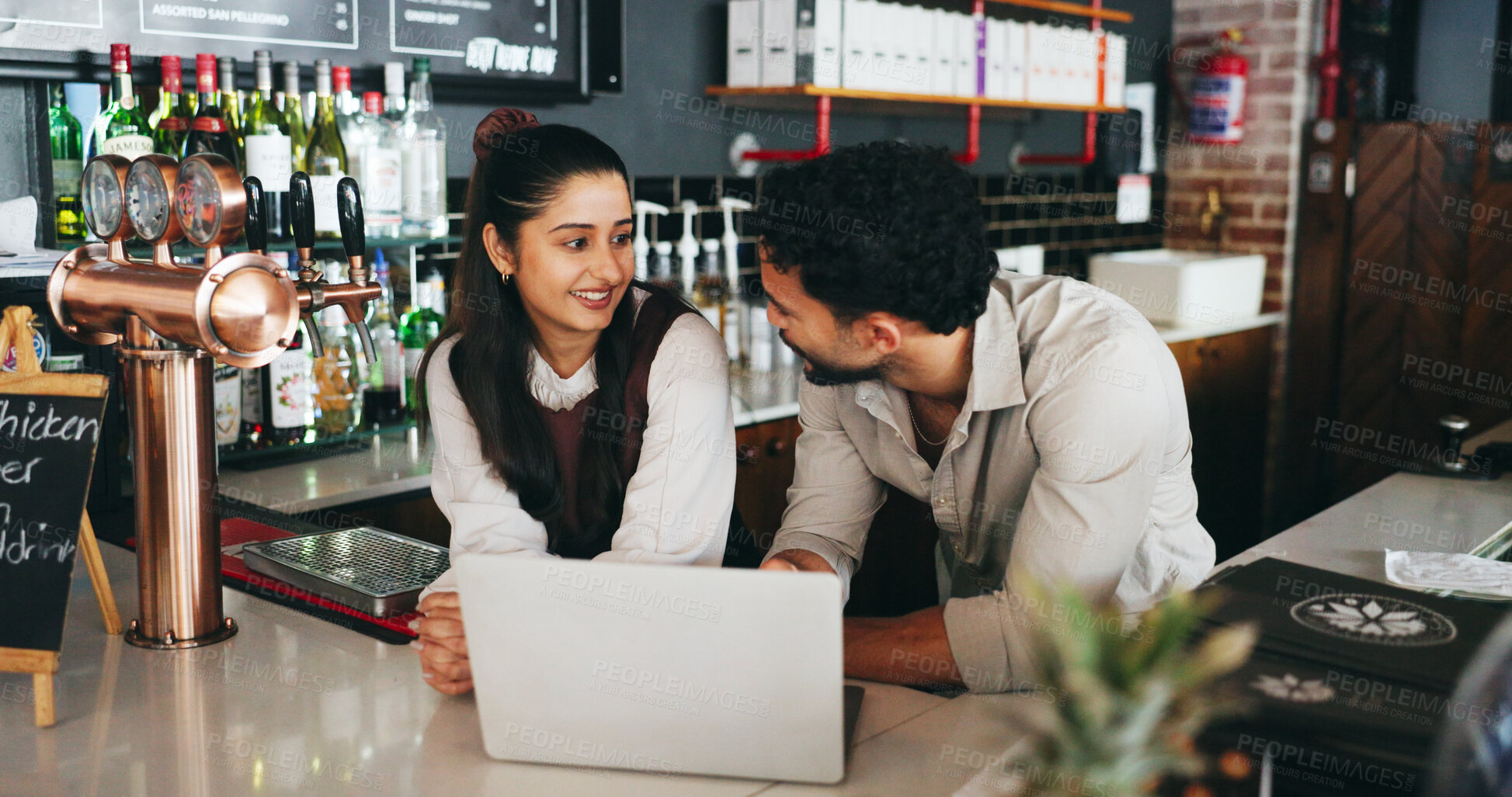 Buy stock photo Manager, people and talk in restaurant with laptop, bartender update or planning menu for hospitality. Business owner, team and discussion by bar with computer, alcohol order or inventory management.