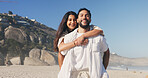 Happy, hug and portrait of couple by beach on holiday, travel or getaway together for honeymoon. Smile, care and woman embrace man by ocean for seaside vacation for marriage, romance or love.