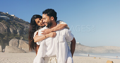 Buy stock photo Smile, couple and hug with piggyback at beach for travel, adventure and bonding together. Space, people and romantic embrace with partner support, relationship commitment and vacation getaway at sea