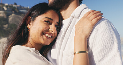 Buy stock photo Hug, smile and thinking with couple on beach together for anniversary, date or honeymoon in summer. Chest, love and romance with happy woman embracing man outdoor for bonding or relationship security
