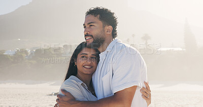 Buy stock photo Hug, smile and thinking with couple on beach together for anniversary, date or honeymoon in summer. Holiday, love and vision with happy people embracing outdoor for bonding, travel or vacation